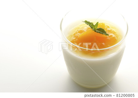 Photographed almond tofu with flesh-filled mango sauce on a white background 81200805
