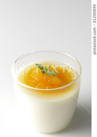 Photographed almond tofu with flesh-filled mango sauce on a white background Photographed almond tofu with flesh-filled mango sauce on a white background 81200849