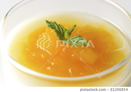 Photographed almond tofu with flesh-filled mango sauce on a white background 81200854