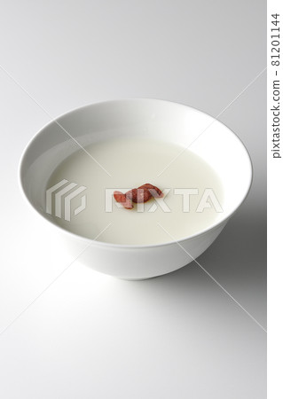 A simple almond tofu with goji berries on a white background 81201144