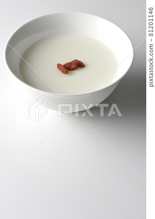 A simple almond tofu with goji berries on a white background A simple almond tofu with goji berries on a white background 81201146