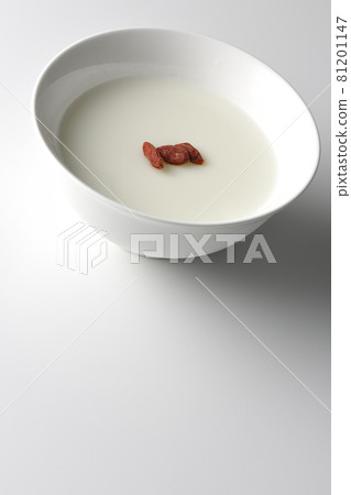A simple almond tofu with goji berries on a white background A simple almond tofu with goji berries on a white background 81201147