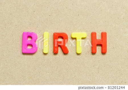 Color alphabet letter with word birth on wood background Color alphabet letter with word birth on wood background 81201244