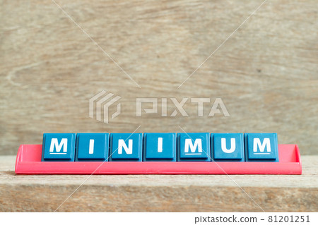 Tile alphabet letter with word minimum in red color rack on wood background Tile alphabet letter with word minimum in red color rack on wood background 81201251