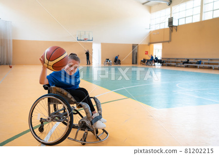 photo of the basketball team of war invalids with professional sports equipment for people with disabilities on the basketball court 81202215
