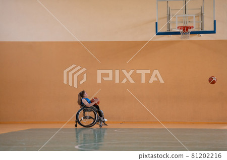 photo of the basketball team of war invalids with professional sports equipment for people with disabilities on the basketball court 81202216