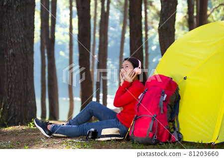 Women listening to music camping tent. Women listening to music camping tent. 81203660