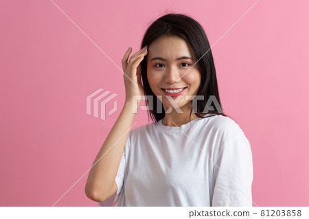 Portrait of asian woman on pink background Portrait of asian woman on pink background 81203858