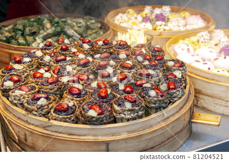 Local street food and snacks sold at the Qibao Old Street in Qibao Ancient Town, a historic water township of Qibao in the Minhang District of Shanghai, China Local street food and snacks sold at the Qibao Old Street in Qibao Ancient Town, a historic water township of Qibao in the Minhang District of Shanghai, China 81204521