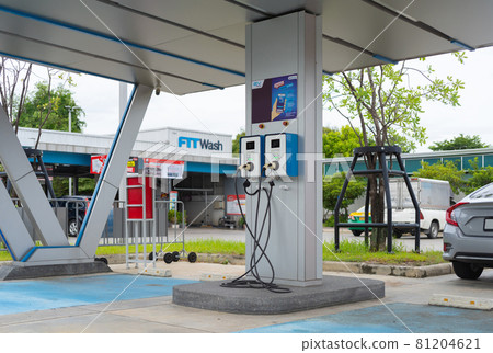 Cable from EV car charger or electric vehicle station. Cable connected at gas station, power supply battery charging an alternative eco environment future technology energy innovation Cable from EV car charger or electric vehicle station. Cable connected at gas station, power supply battery charging an alternative eco environment future technology energy innovation 81204621
