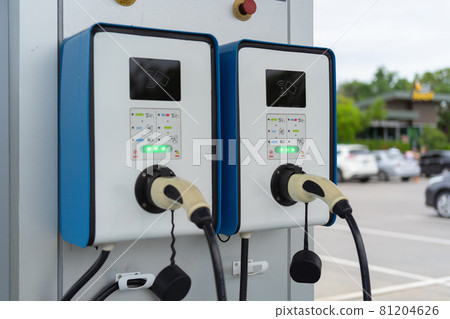 Cable from EV car charger or electric vehicle station. Cable connected at gas station, power supply battery charging an alternative eco environment future technology energy innovation Cable from EV car charger or electric vehicle station. Cable connected at gas station, power supply battery charging an alternative eco environment future technology energy innovation 81204626