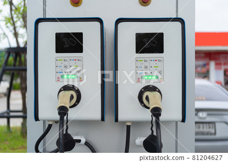 Cable from EV car charger or electric vehicle station. Cable connected at gas station, power supply battery charging an alternative eco environment future technology energy innovation Cable from EV car charger or electric vehicle station. Cable connected at gas station, power supply battery charging an alternative eco environment future technology energy innovation 81204627