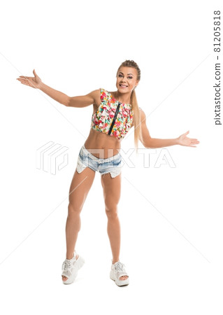 Cheerful young woman in summer outfit in studio Cheerful young woman in summer outfit in studio 81205818