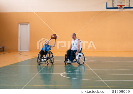 a young woman playing wheelchair basketball in a professional team. Gender equality, the concept of sports with disabilities.  81209099