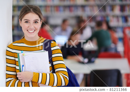 the student uses a notebook and a school library the student uses a notebook and a school library 81211366