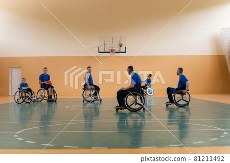 training of the basketball team of war invalids with professional sports equipment for people with disabilities on the basketball court 81211492