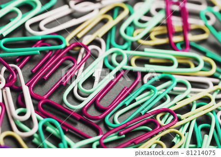 Colored paper clips textured background full screen 81214075