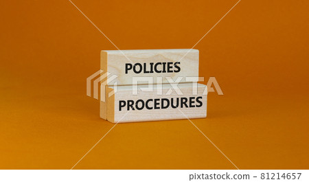 Policies and procedures symbol. Wooden blocks with concept words Policies procedures on orange background. Business and policies and procedures concept. Copy space. 81214657