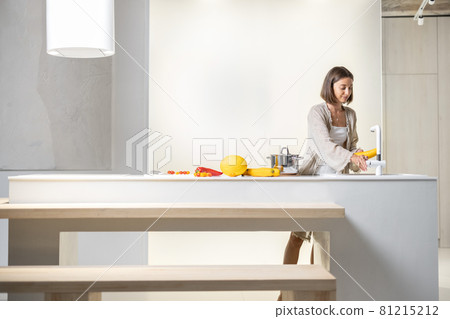 Woman cooking healthy at modern kitchen 81215212