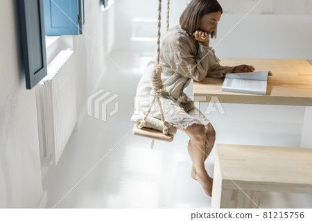 Woman having leaisure time at comfortable home 81215756