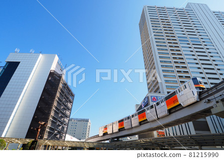 Monorail running through the valley of high-rise buildings | At Tachikawa Station 81215990