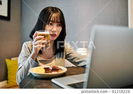 Women having an online drinking party at home Women having an online drinking party at home 81218228