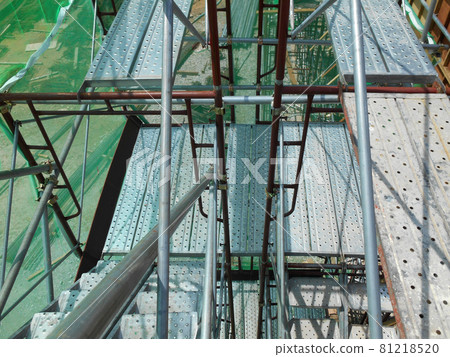 MALACCA, MALAYSIA -MAY 04, 2016: Temporary access and staircase supported by reinforced scaffolding at the construction site. MALACCA, MALAYSIA -MAY 04, 2016: Temporary access and staircase supported by reinforced scaffolding at the construction site. 81218520