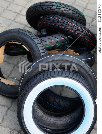 SEPANG, MALAYSIA -OCTOBER 25, 2015: Racing motorcycle tire display for public during 2015 MotorGP tournament in Sepang Circuit. SEPANG, MALAYSIA -OCTOBER 25, 2015: Racing motorcycle tire display for public during 2015 MotorGP tournament in Sepang Circuit. 81218570