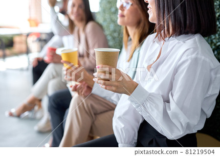 business, communication and education concept. group of colleagues drinking coffee business, communication and education concept. group of colleagues drinking coffee 81219504