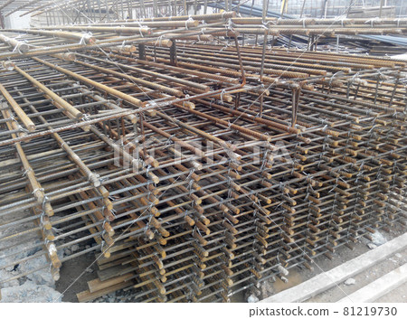 SELANGOR, MALAYSIA -MAY 18, 2016: Hot rolled deformed steel bars or steel reinforcement bar tied together before cast in the concrete. Its function is to increase the concrete strength. SELANGOR, MALAYSIA -MAY 18, 2016: Hot rolled deformed steel bars or steel reinforcement bar tied together before cast in the concrete. Its function is to increase the concrete strength. 81219730