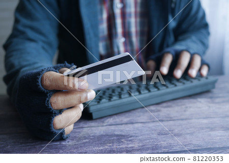 hacker hand stealing data from credit card hacker hand stealing data from credit card 81220353