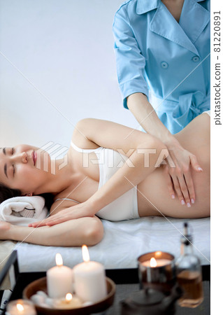 Female therapist hands massaging gravid woman,for treat and relax program,at spa therapy Female therapist hands massaging gravid woman,for treat and relax program,at spa therapy 81220891