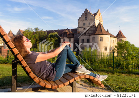 Young woman rests at Meersburg Castle, Germany Young woman rests at Meersburg Castle, Germany 81223171
