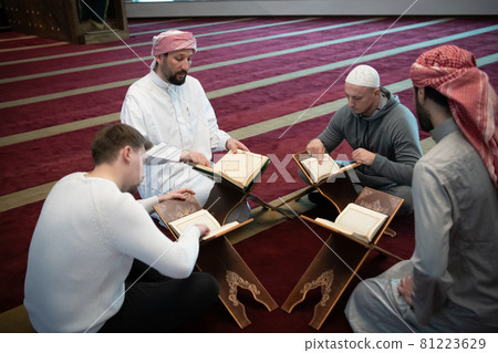 muslim people in mosque reading quran together muslim people in mosque reading quran together 81223629