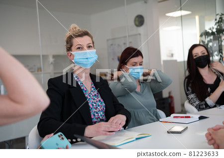 real business people on meeting wearing protective mask real business people on meeting wearing protective mask 81223633