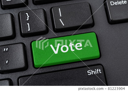 Vote green key on a black pc keyboard. Online participation in elections, internet voting. Vote green key on a black pc keyboard. Online participation in elections, internet voting. 81223904
