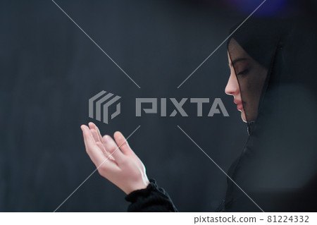 Portrait of young Muslim woman making dua 81224332