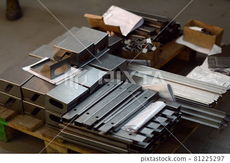 Final stage CNC material. Metal products after processing on CNC machines stand on pallets ready for transport Final stage CNC material. Metal products after processing on CNC machines stand on pallets ready for transport 81225297