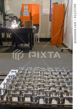 The first phase of metal and aluminum processing. Processed products from CNC machines stacked on a pallet in a large modern factory 81225395