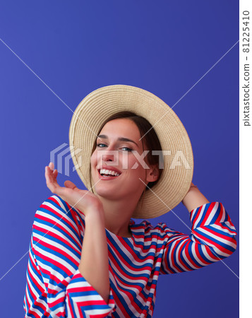 Portrait of young woman sitting on the chair Portrait of young woman sitting on the chair 81225410