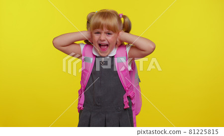 Frustrated annoyed irritated girl in school uniform covering ears and gesturing no, avoiding advice Frustrated annoyed irritated girl in school uniform covering ears and gesturing no, avoiding advice 81225815