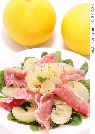 Tosa Pomelo and prosciutto salad, large citrus fruits, bright background Tosa Pomelo and prosciutto salad, large citrus fruits, bright background 81226528
