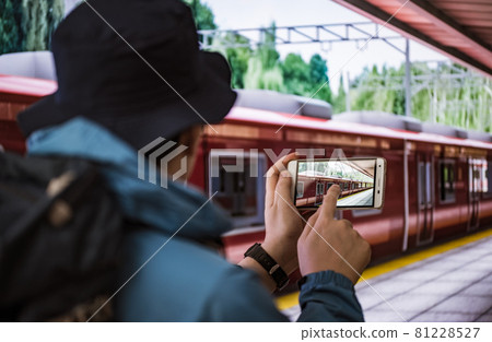 A man going out by train 81228527
