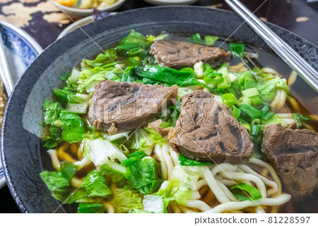 Taiwan beef noodle, a close up of Taiwanese tradition seasoned soup beef noodles with vegetable in food restaurant. Taiwan beef noodle, a close up of Taiwanese tradition seasoned soup beef noodles with vegetable in food restaurant. 81228597