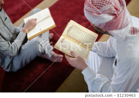 two muslim people in mosque reading quran together concept of islamic education two muslim people in mosque reading quran together concept of islamic education 81230463