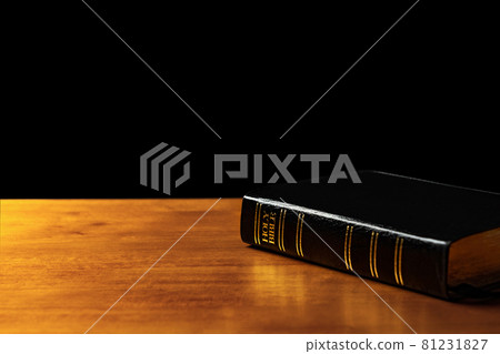 Holy Bible Closeup. Holy Bible on the Small Aged Wooden Table 81231827