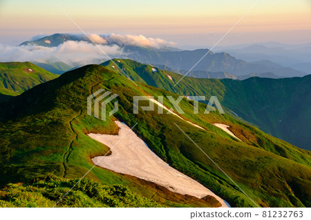Mt. Asahi (Asahi mountain range), a famous mountain with alpine plants in full bloom and a magnificent mountain landscape woven by beautiful ridges and snowy valleys Mt. Asahi (Asahi mountain range), a famous mountain with alpine plants in full bloom and a magnificent mountain landscape woven by beautiful ridges and snowy valleys 81232763