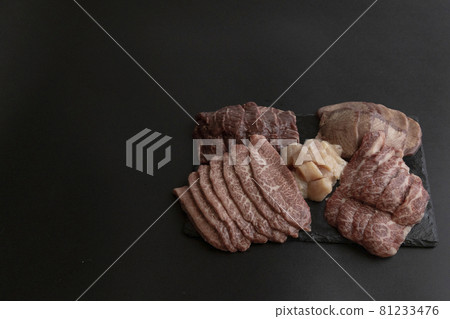 Assorted grilled meat, black background, copy space, to the right 81233476