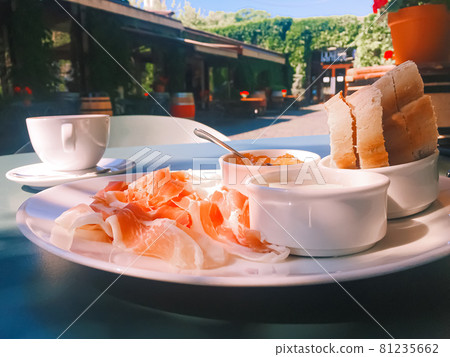 Breakfast outdoors in summer, ham, jam, butter and ham 81235662