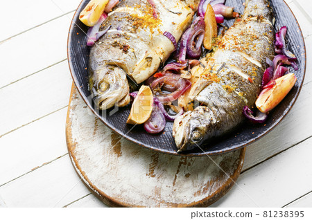 Whole baked rainbow trout on the plate Whole baked rainbow trout on the plate 81238395